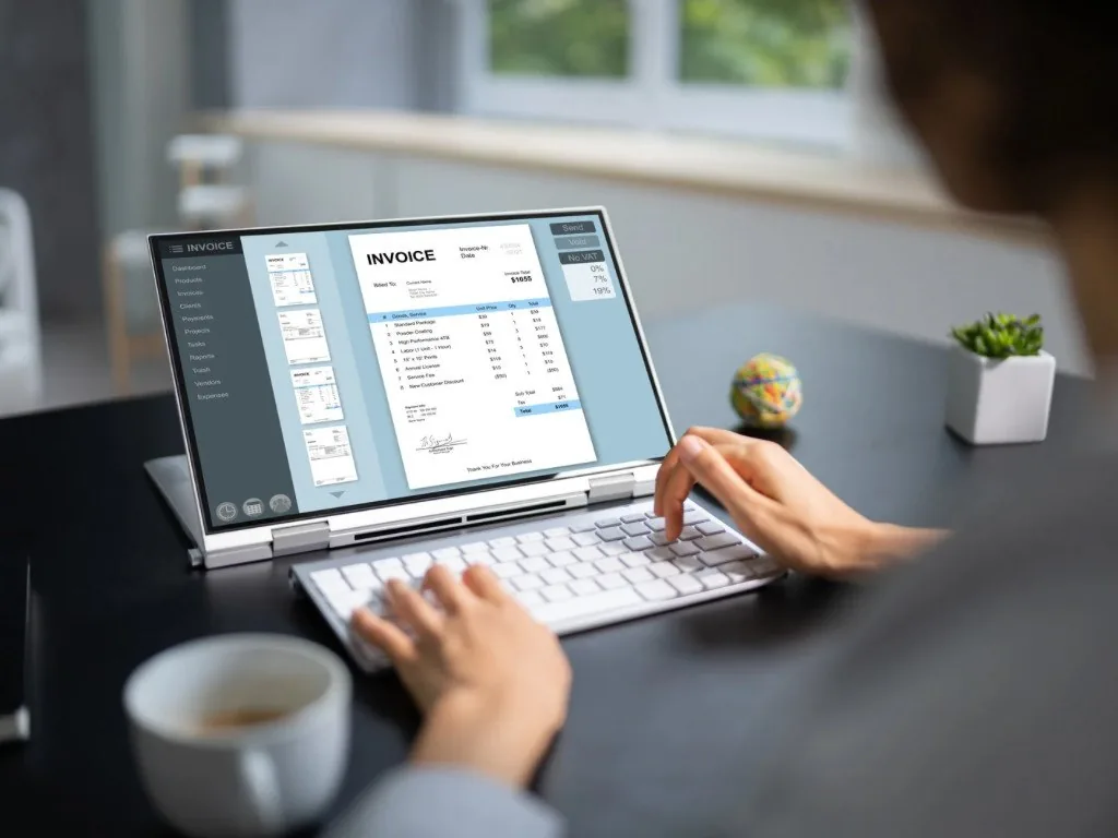 Automated invoicing and payments dashboard on a laptop